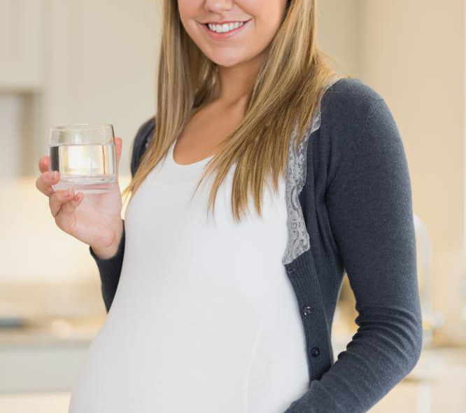 pregnant woman drinking ionized water